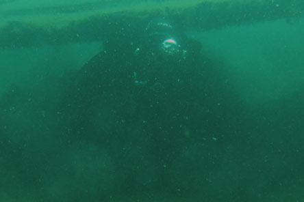 scuba diver in low visibility water